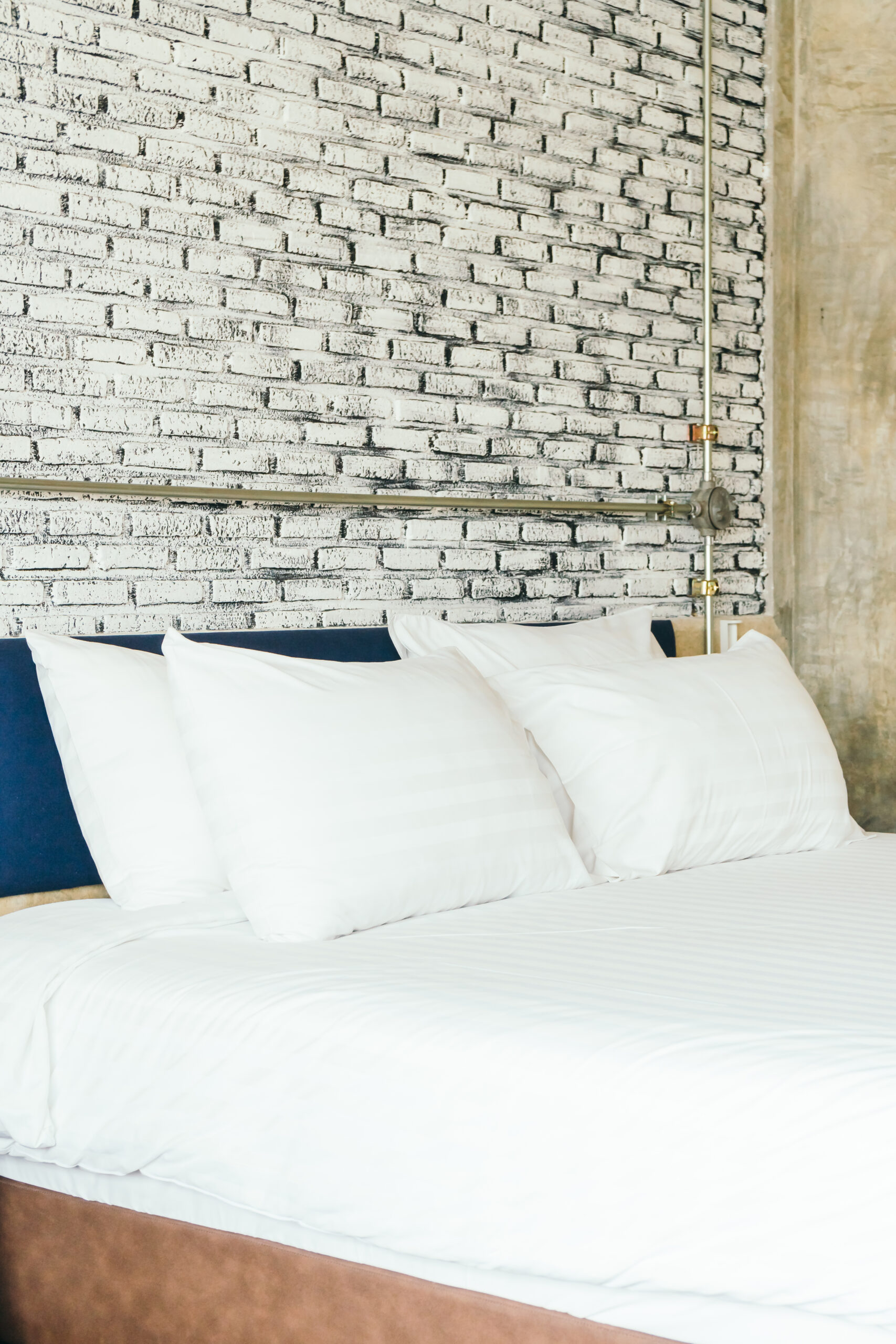 White pillow on bed decoration in bedroom interior